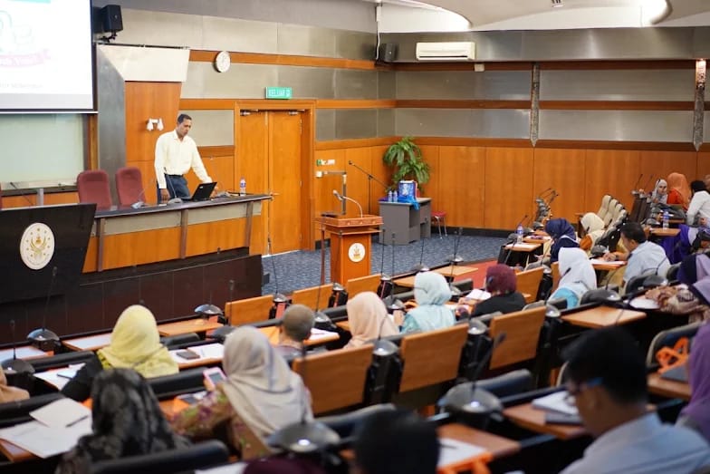 Facilitator leading a security posture assessment workshop with seated participants